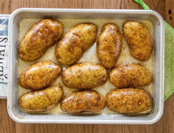 How do you cook baked potatoes on a BBQ?